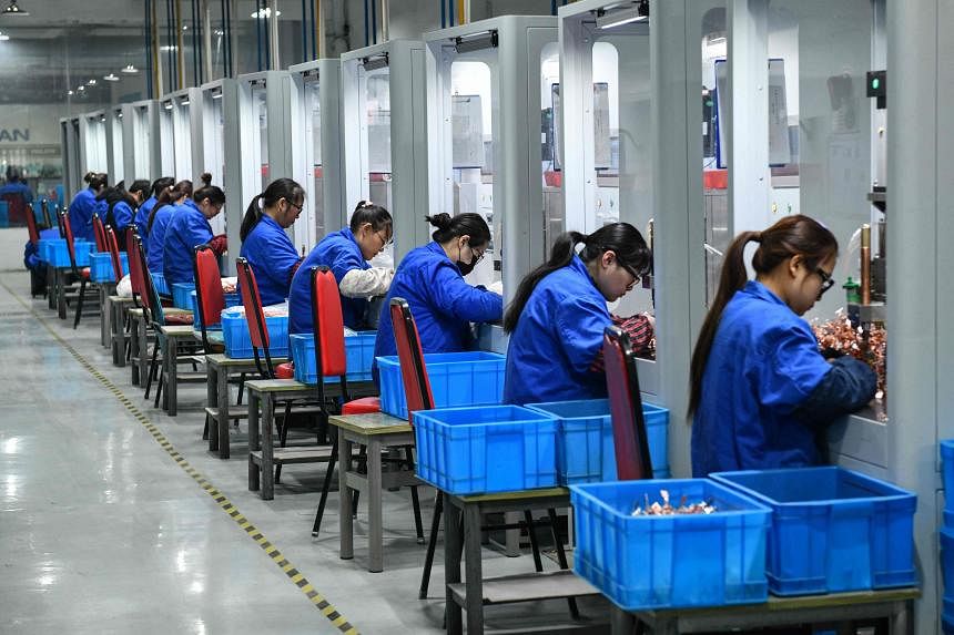 China's factory activity shrinks again as economy suffers from weak demand